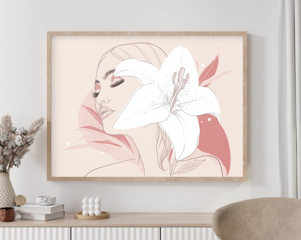 יצירת האמנות הממוסגרת "תמונה מעל המיטה בעיצוב מינימליסטי אישה ושושן לבן" תלויה על הקיר. הוא מתאר פניה של אישה בעיניים עצומות, מתוארים בקווים ורודים רכים עם פרח שושן לבן גדול המשולב בעיצוב. מתחת למסגרת, שולחן קונסולה לבן מעוטר בפרחים, ספרים ופריטי עיצוב קטנים.